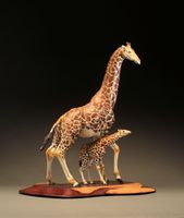 "Height of Curiosity"
Cast bronze mother giraffe with baby on a handmade cocobolo wood base
<br />
<a href="/gallery.html?gallery=View Height Curiosity" target="_top">click here for additional photos of this piece</a>