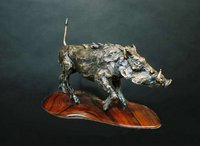"Attitude"
Cast bronze wart hog on a handmade cocobolo wood base