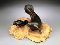 "Naiads"
Cast bronze mother and calf manatees on a buckeye burl base